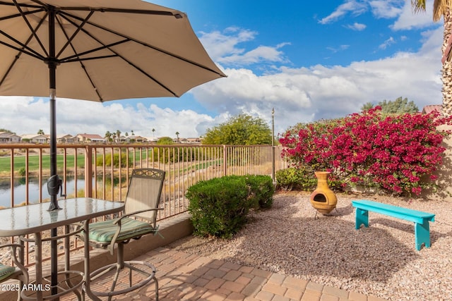 view of patio featuring a water view