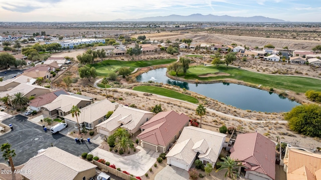 birds eye view of property with a water and mountain view