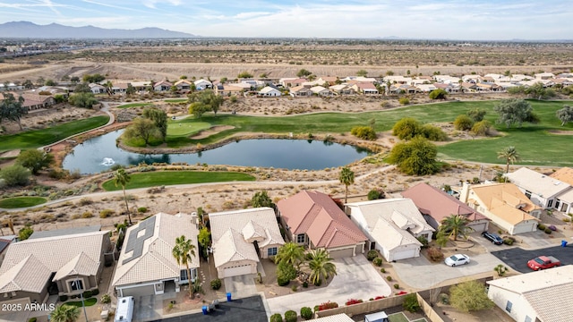 drone / aerial view with a water and mountain view