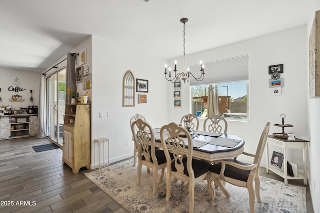 1135 E Barrus Dr, Casa Grande, AZ 85122 - dining space with baseboards, wood finished floors, a healthy amount of sunlight, and a chandelier