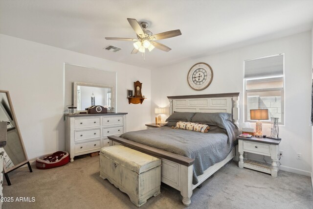 1135 E Barrus Dr, Casa Grande, AZ 85122 - bedroom with baseboards, ceiling fan, visible vents, and light carpet