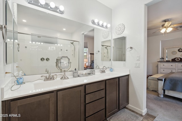 1135 E Barrus Dr, Casa Grande, AZ 85122 - bathroom with a ceiling fan, a sink, connected bathroom, and a shower stall