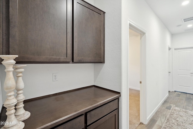 1135 E Barrus Dr, Casa Grande, AZ 85122 - corridor with baseboards, visible vents, light wood-style flooring, and recessed lighting