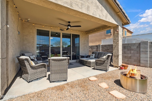 1135 E Barrus Dr, Casa Grande, AZ 85122 - view of patio / terrace with an outdoor living space with a fire pit, fence, and ceiling fan