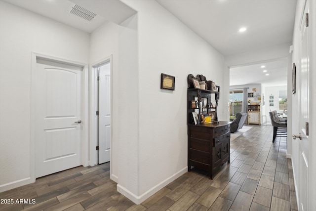 1135 E Barrus Dr, Casa Grande, AZ 85122 - hall with baseboards, visible vents, recessed lighting, and wood finish floors
