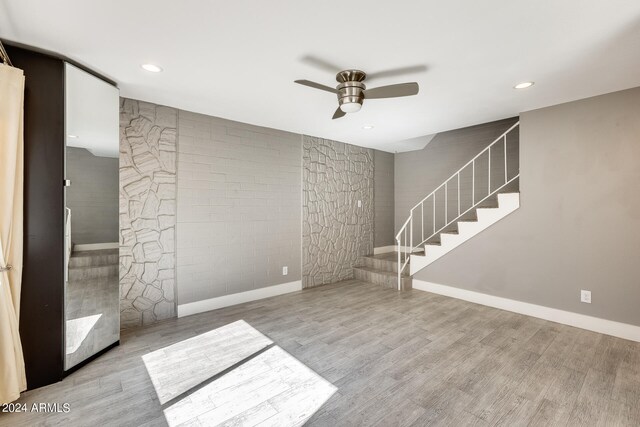 unfurnished room featuring light wood-type flooring and ceiling fan