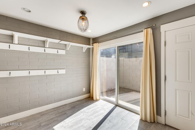 interior space with hardwood / wood-style flooring and walk in shower