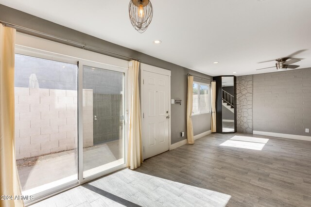 doorway to outside featuring hardwood / wood-style flooring and ceiling fan