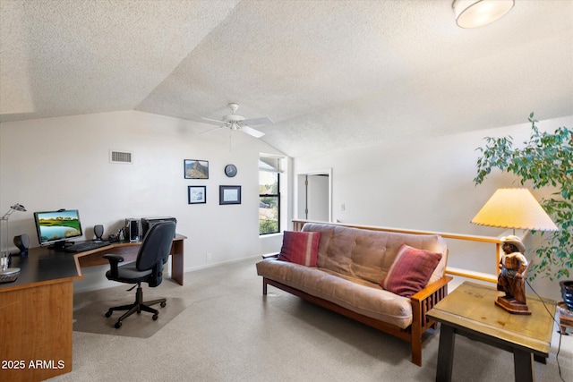 office area with a textured ceiling, ceiling fan, carpet, and lofted ceiling