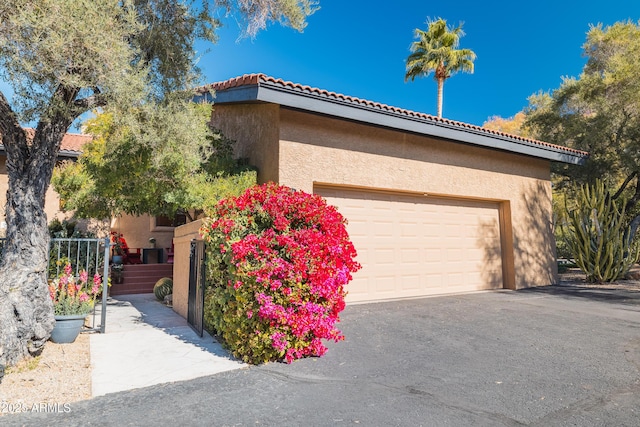 view of property exterior with a garage