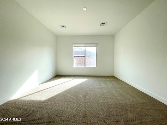 spare room featuring carpet flooring