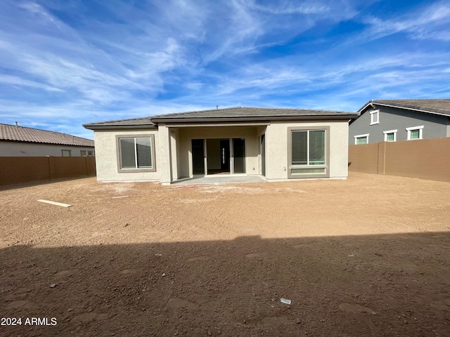 back of property with a patio area