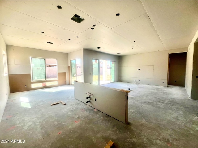 unfurnished room featuring concrete floors