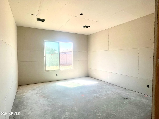 empty room featuring concrete flooring