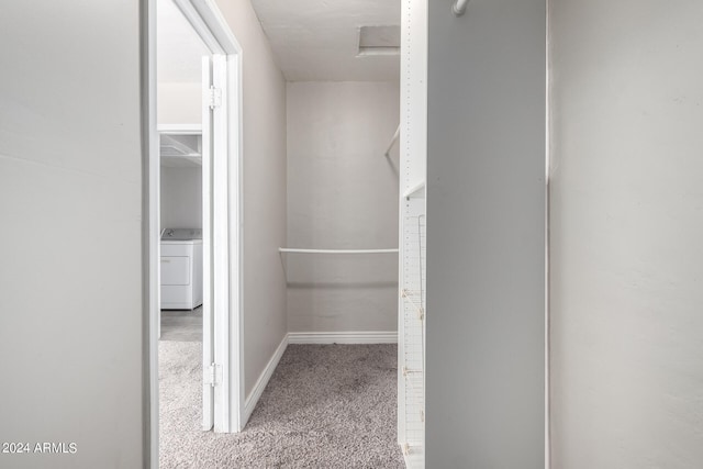 spacious closet with carpet flooring and washer / clothes dryer