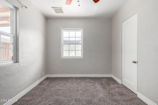 carpeted empty room with ceiling fan