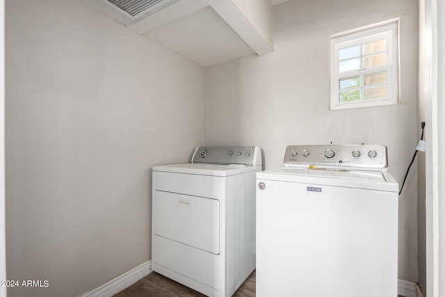 laundry area with washing machine and clothes dryer