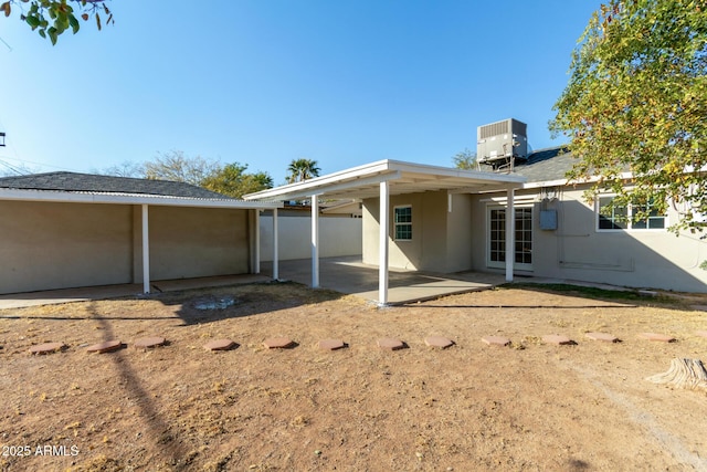 back of property with a patio area and cooling unit