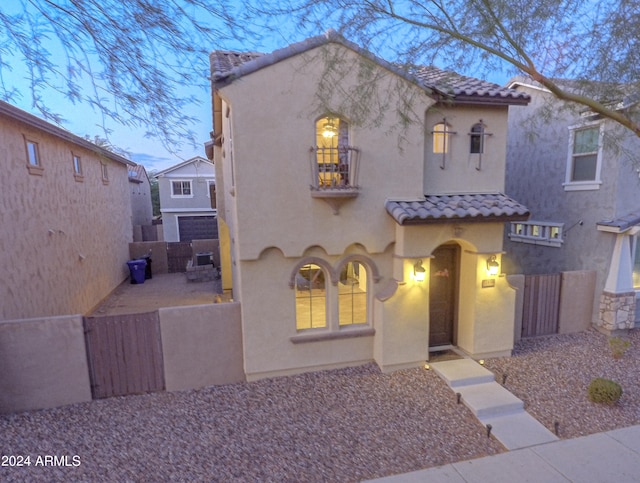 mediterranean / spanish-style house with a patio area