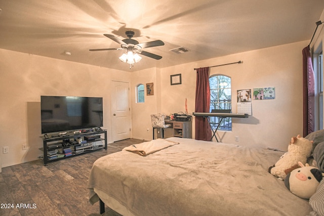 bedroom with dark wood-type flooring and ceiling fan