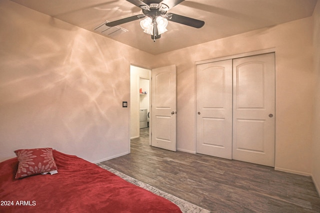 unfurnished bedroom with a closet, dark hardwood / wood-style floors, and ceiling fan