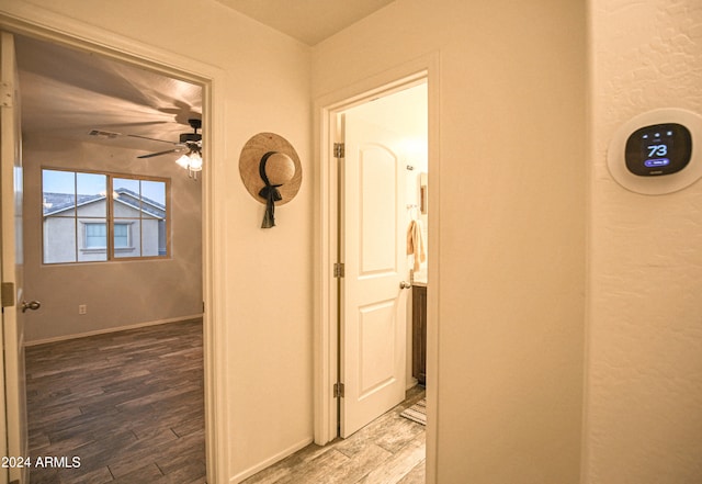 corridor featuring hardwood / wood-style floors