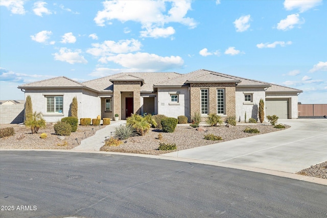 prairie-style home featuring a garage