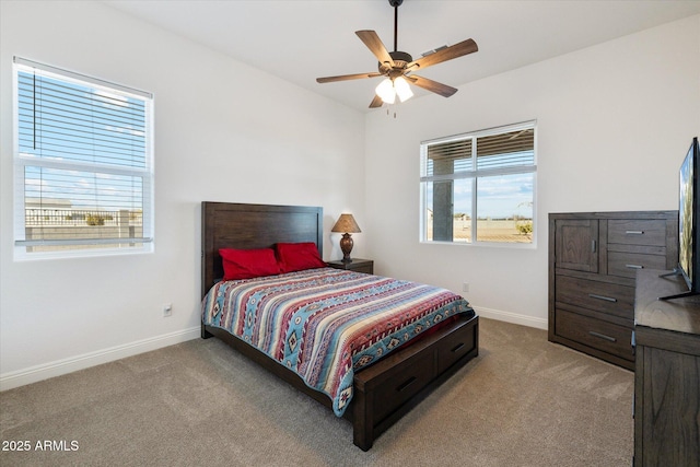 bedroom featuring ceiling fan and light colored carpet