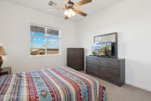 bedroom featuring ceiling fan and light carpet