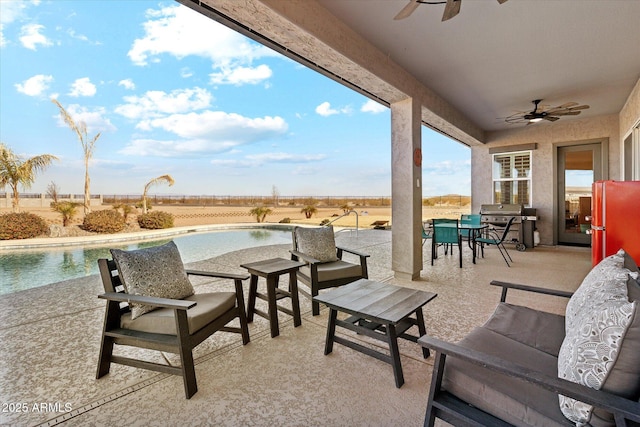 view of patio featuring ceiling fan and an outdoor living space