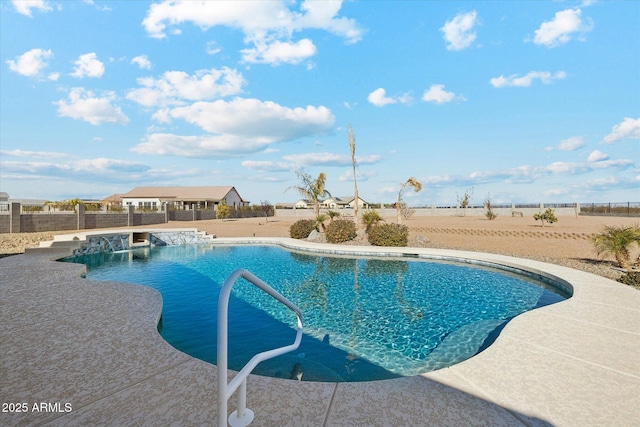 view of pool with pool water feature and a patio area