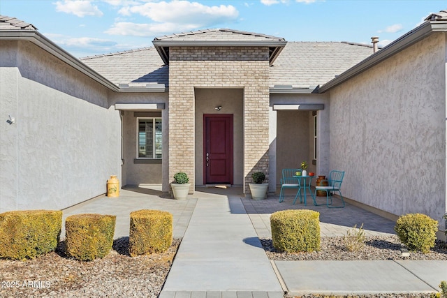 entrance to property with a patio area