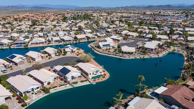 drone / aerial view featuring a residential view and a water and mountain view