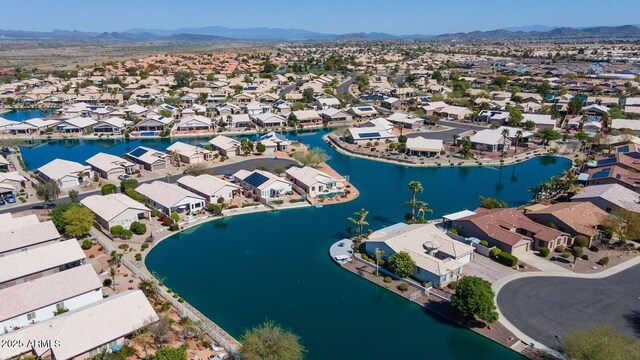 drone / aerial view with a residential view and a water and mountain view