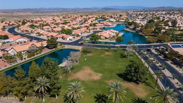 birds eye view of property with a residential view and a water and mountain view