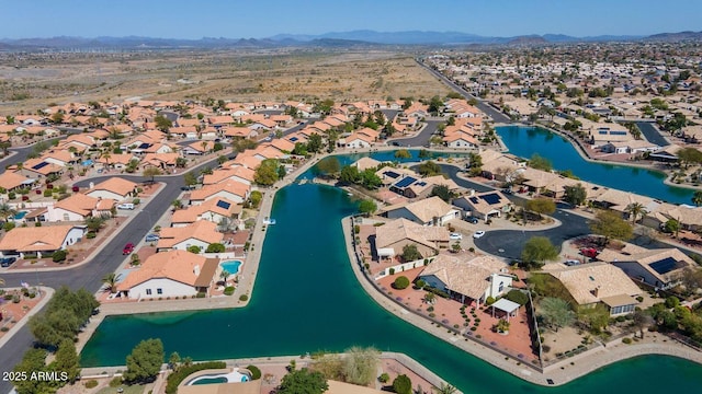 birds eye view of property with a residential view and a water and mountain view