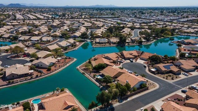 birds eye view of property featuring a residential view and a water view