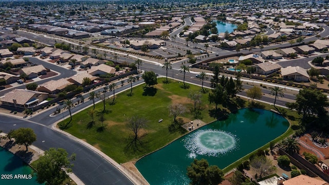 aerial view with a residential view and a water view