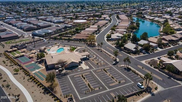 drone / aerial view featuring a residential view and a water view