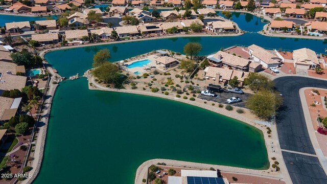 bird's eye view with a residential view and a water view