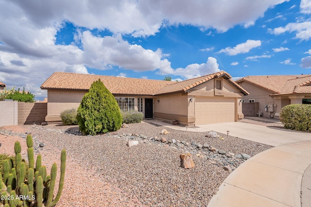 ranch-style home featuring fence, driveway, an attached garage, stucco siding, and a tiled roof