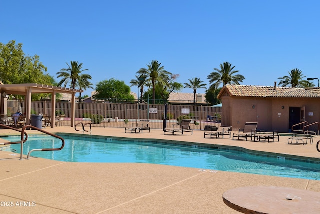 community pool featuring a patio, fence, and a pergola