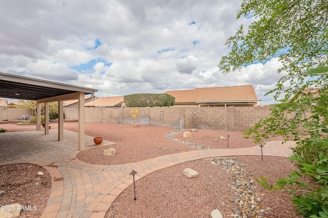 view of yard with a patio and a fenced backyard