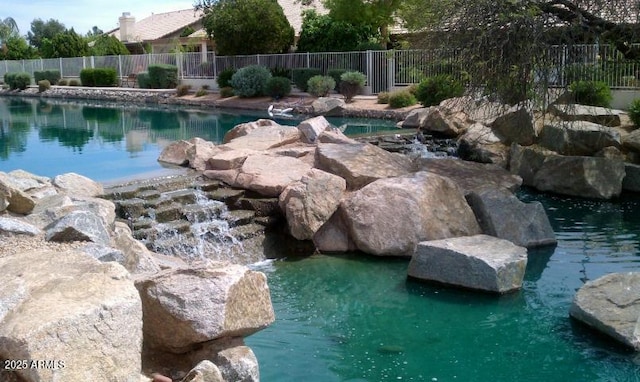 view of pool with fence