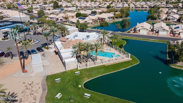 drone / aerial view with a residential view and a water view