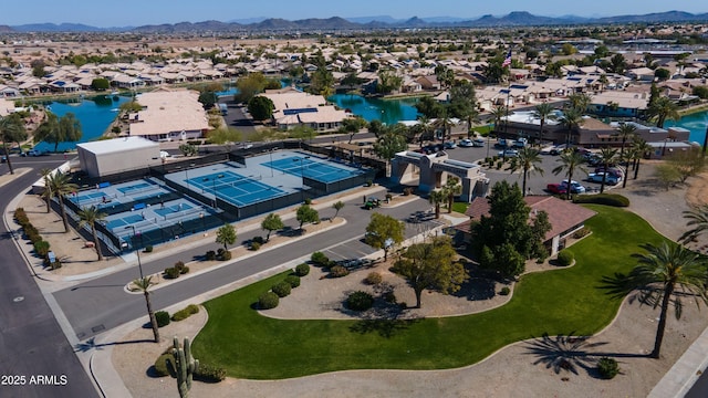 bird's eye view featuring a residential view and a water and mountain view