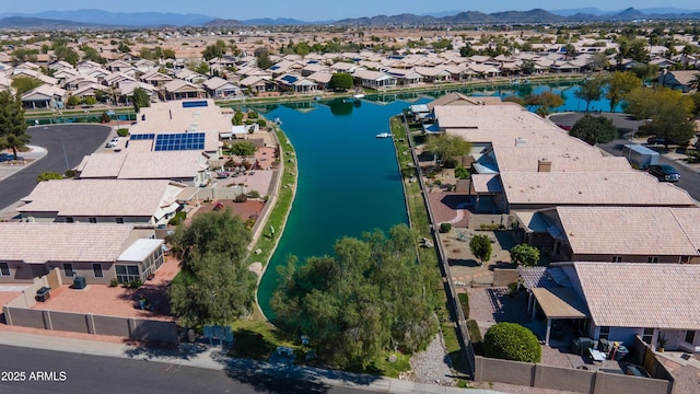 bird's eye view with a residential view and a water and mountain view