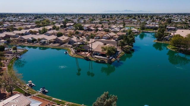 bird's eye view with a residential view and a water view