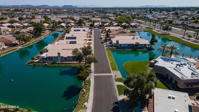 birds eye view of property with a residential view and a water and mountain view