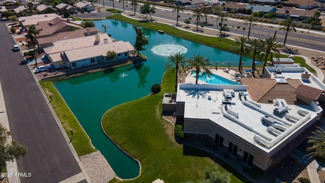 bird's eye view featuring a residential view and a water view